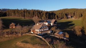 an aerial view of a large house on a hill at Webergütl in Auna di Sopra