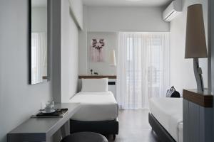 Letto o letti in una camera di Lato Boutique Hotel
