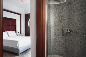 Letto o letti in una camera di Lato Boutique Hotel