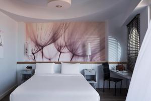 Letto o letti in una camera di Lato Boutique Hotel