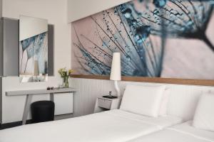 Letto o letti in una camera di Lato Boutique Hotel