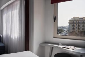 Letto o letti in una camera di Lato Boutique Hotel