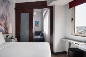 Letto o letti in una camera di Lato Boutique Hotel