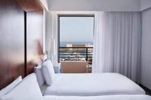 Letto o letti in una camera di Lato Boutique Hotel