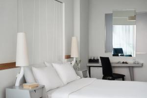 Letto o letti in una camera di Lato Boutique Hotel