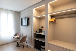 TV a/nebo společenská místnost v ubytování YOU & CO. J. Botánico Boutique