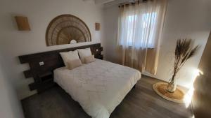 En eller flere senger på et rom på Villa Delta Spa