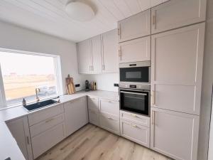 Una cocina o zona de cocina en Garður Apartments