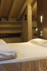 A bed or beds in a room at Borgo Santa Giulia