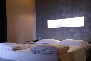 A bed or beds in a room at Borgo Santa Giulia