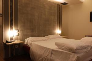 A bed or beds in a room at Borgo Santa Giulia