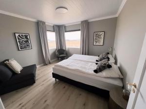 Cama o camas de una habitación en Garður Apartments