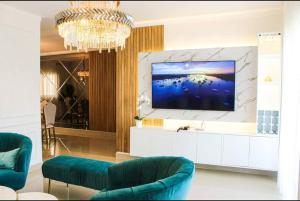 Et tv og/eller underholdning på Confortable Dpto en Residencial