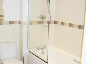 a bathroom with a shower and a toilet at Hidden Gem in Manchester +17 photos