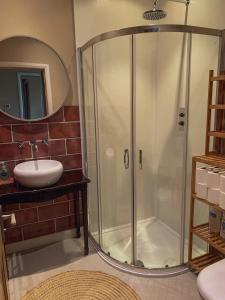 a bathroom with a shower and a sink at Unique Highland in Inverness