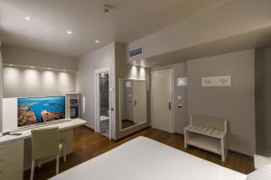 Postel nebo postele na pokoji v ubytování Hotel Touring + 37 fotografií