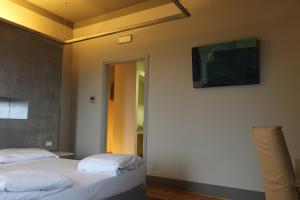 A bed or beds in a room at Borgo Santa Giulia