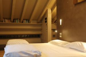 A bed or beds in a room at Borgo Santa Giulia