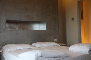 A bed or beds in a room at Borgo Santa Giulia