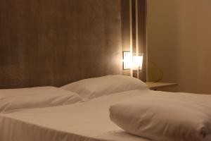 A bed or beds in a room at Borgo Santa Giulia