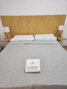 A bed or beds in a room at Petit Balcarce Salta