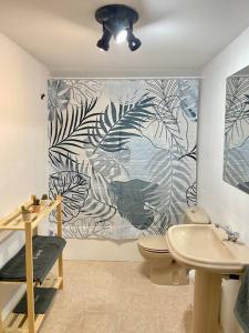 a bathroom with a toilet and a sink at Apartamento Espert Biescas in Biescas