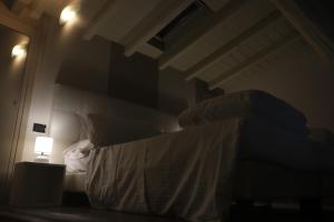 A bed or beds in a room at Borgo Santa Giulia