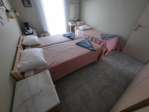 Ένα ή περισσότερα κρεβάτια σε δωμάτιο στο Γιασεμί