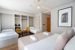 Postel nebo postele na pokoji v ubytování YOU & CO. J. Botánico Boutique