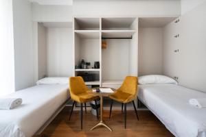Postel nebo postele na pokoji v ubytování YOU & CO. J. Botánico Boutique