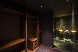 a bathroom with a shower with a glass enclosure at Hotel Touring in Ferrara