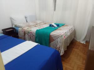 HOSTEL e POUSADA SALVADOR PRAIAにあるベッド