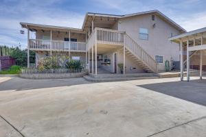 een groot huis met een trap op een oprit bij Chic El Cajon Apartment 20 Mi to San Diego in El Cajon