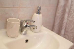 een wastafel met een zeepdispenser bij Holiday home in Vrbnik - Insel Krk 45797 in Vrbnik +40 foto's