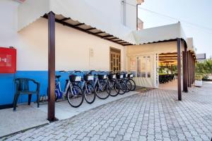 a group of bikes parked next to a building at Camping Villaggio Il Frutteto in Cupra Marittima