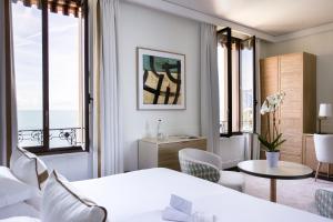 Hotel Royal-Riviera客房内的一张或多张床位