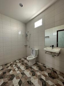 a bathroom with a toilet and a sink at 24 Sleep Resort Khlong Luang Hospital in Khlong Luang