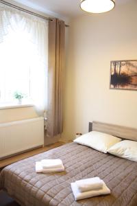 Кровать или кровати в номере Apartament Integro