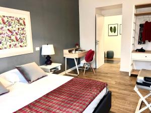 A bed or beds in a room at Le Stanze Di Catia