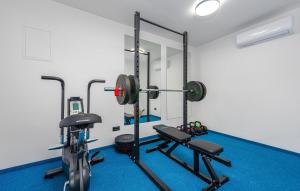a gym with two weights and two treadmills at Cdi706 in Murvica