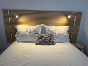 Кровать или кровати в номере Living PDL 2