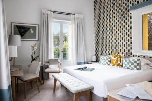 Hotel Royal-Riviera客房内的一张或多张床位
