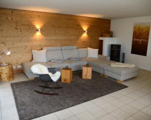 a living room with a couch and a chair at Ferienhaus Oberwiesenthal in Kurort Oberwiesenthal