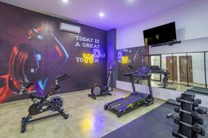 a gym with three exercise bikes in a room at WinDay Hotel Express in Veracruz