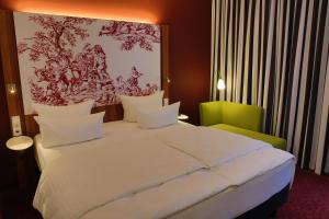 Postel nebo postele na pokoji v ubytování IBB Hotel Ingelheim