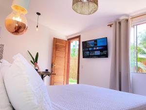 TV a/nebo společenská místnost v ubytování Meu Quintal Suítes - Búzios + 18 fotografií