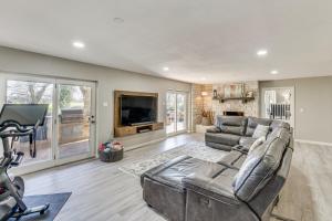 a living room with a couch and a television at Seguin Riverfront Retreat Fishing Dock and Kayaks! in Seguin