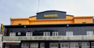 a building with a sign on the top of it at SOFT HOTEL in Douala