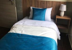 Postel nebo postele na pokoji v ubytování Hotel Suites La Fontana
