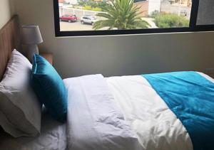 Postel nebo postele na pokoji v ubytování Hotel Suites La Fontana